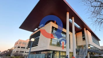 QUEL Q logo on image of Stanford'sLi Ka Shing Center